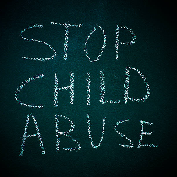 sentence stop child abuse written in a chalkboard
